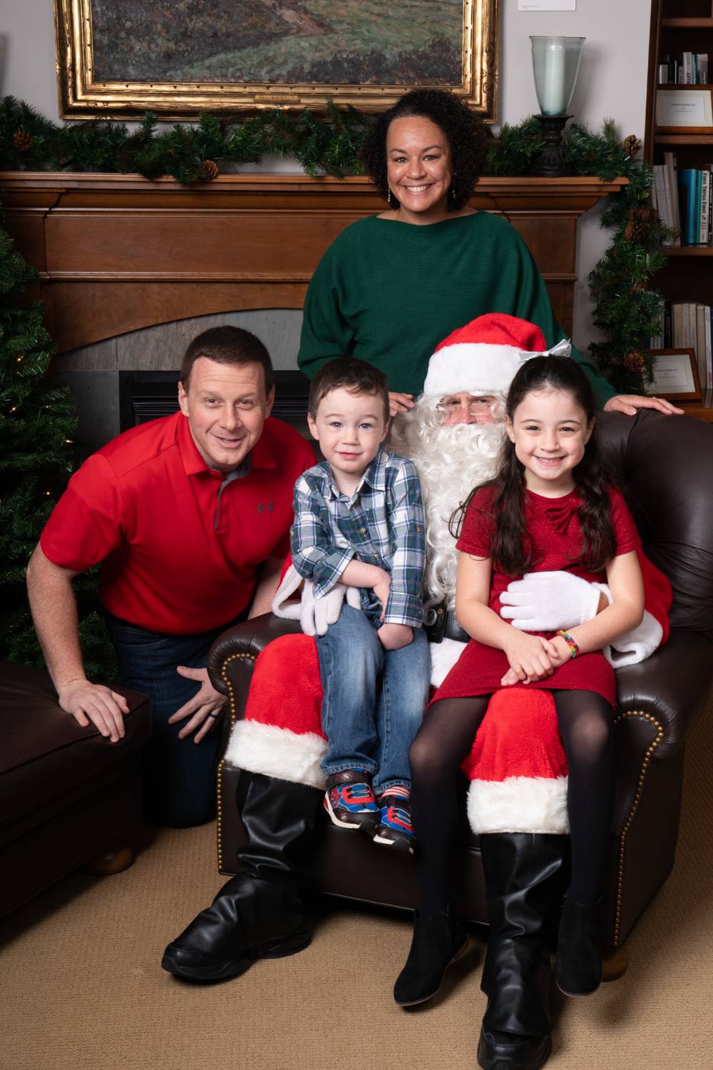 Family of four with Santa.